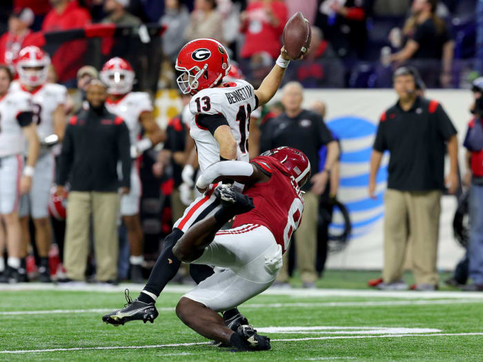 Stetson Bennett loses the ball when he is hit