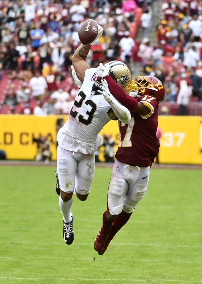 New Orleans Saints cornerback Marshon Lattimore (23) breaks up a pass intended for Washington wide receiver Terry McLaurin (17).  Mandatory Credit: Brad Mills-USA TODAY 
