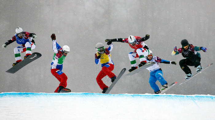 Pierre Vaultier races against competitors during the second heat of the semifinals in men's snowboard cross during the Sochi 2014 Olympic Winter Games at Rosa Khutor Extreme Park.