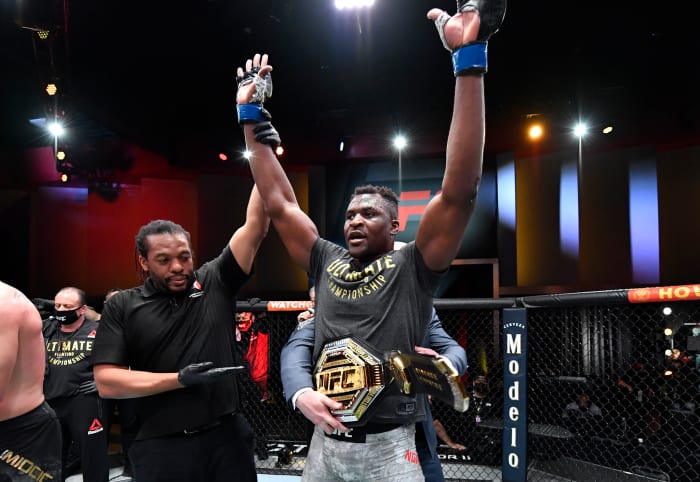 Francis Ngannou celebrates his victory over Stipe Miocic in the UFC heavyweight championship fight at UFC 260 on March 27, 2021.