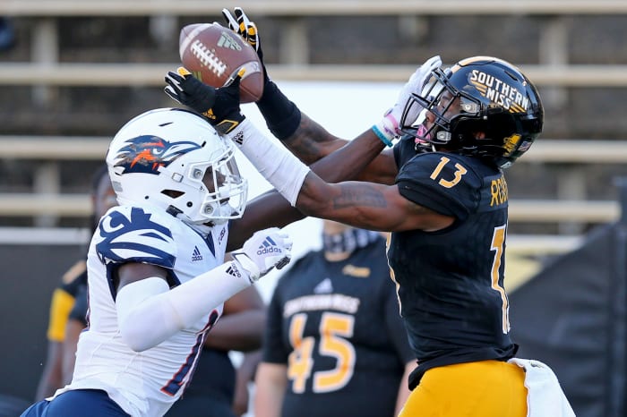 NCAA Football: Texas-San Antonio at South Mississippi Nov. 21, 2020;  Hattiesburg, Mississippi, USA;  UTSA Roadrunners cornerback Tariq Woolen (20) breaks up a pass intended for Southern Miss Golden Eagles wide receiver Antoine Robinson (13) in the second quarter at MM Roberts Stadium.