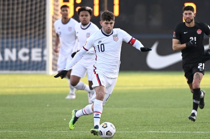 Christian Pulisic playing for the USMNT vs.  Canada