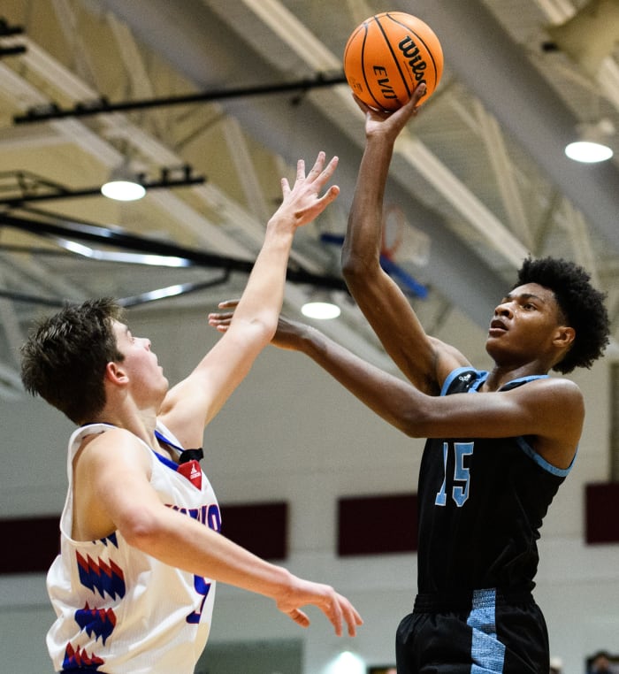 Dorman's Noah Clowney (15) attempts to shoot the ball over Riverside's Charlie Myers (5) during their game Friday, Feb. 4, 2022.