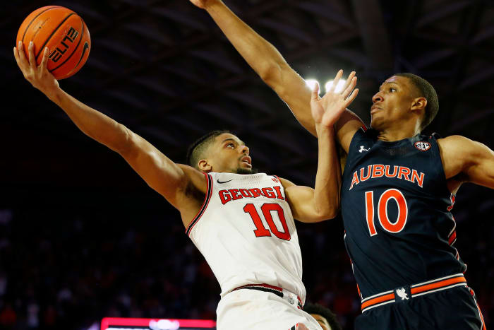 Feb. 5, 2022; Athens, Georgia, USA; Georgia Bulldogs guard Aaron Cook (10) shoots over Auburn Tigers forward Jabari Smith (10) at Stegeman Coliseum. Mandatory Credit: Joshua L. Jones/Athens Banner-Herald via USA TODAY NETWORK Ncaa Basketball Auburn At Georgia