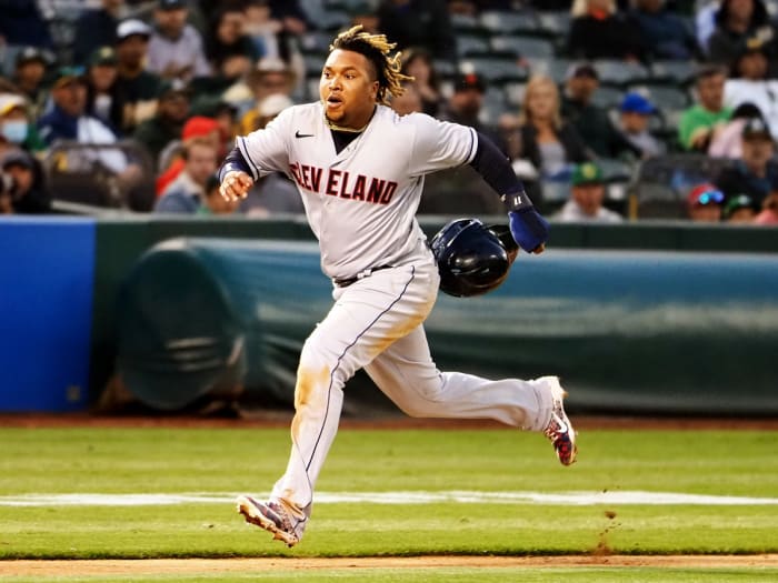 Jul 16, 2021; Oakland, California, USA; Cleveland Indians third baseman José Ramírez (11) runs home to score a run against the Oakland Athletics during the sixth inning at RingCentral Coliseum.