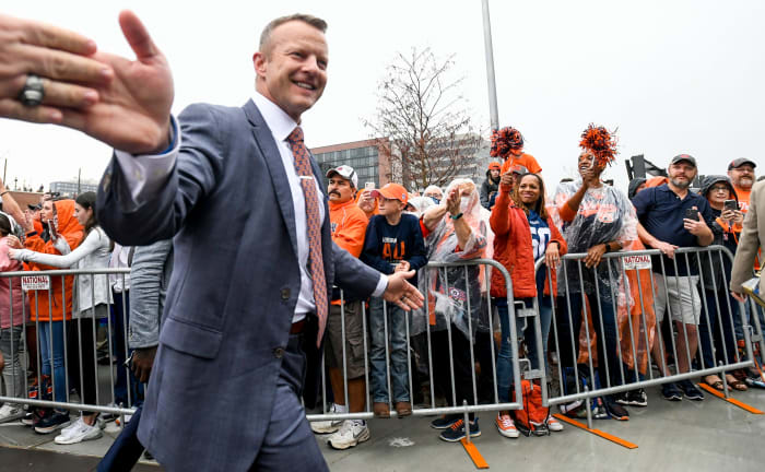 Auburn Tigers head coach Bryan Harsin salutes fans during the Tiger Walk prior to the Birmingham Bowl at Protective Stadium in Birmingham, Alabama on Tuesday, December 28, 2021. Pre08