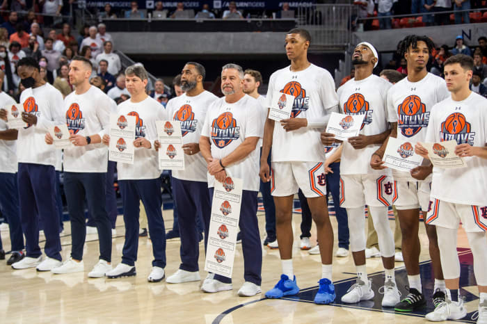 Auburn Tigers head coach Bruce Pearl and his players honor cancer victims during the AUTLIVE game as Auburn Tigers men's basketball takes on Texas A&M Aggies at Auburn Arena in Auburn, Ala., on Saturday, Feb. 12, 2022. Auburn Tigers lead Texas A&M Aggies 33-18 at halftime.