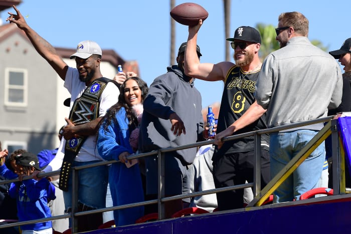 Feb 16, 2022; Los Angeles, CA, USA; Los Angeles Rams wide receiver Cooper Kupp and outside linebacker Leonard Floyd celebrate during the Los Angeles Rams Championship Parade. Mandatory Credit: Gary A. Vasquez-USA TODAY Sports