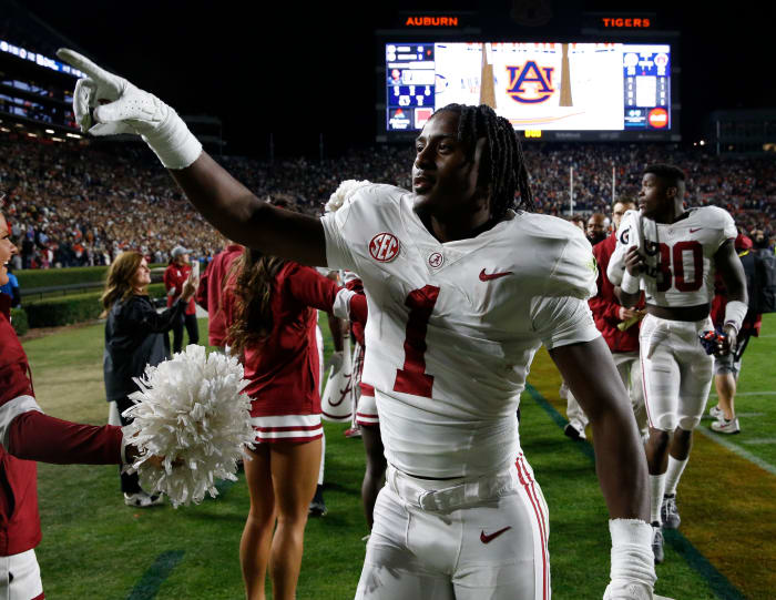 Alabama Crimson Tide defensive back Kool-Aid McKinstry (1) celebrates as he leaves the field after defeating the Auburn Tigers at Jordan-Hare Stadium.  Alabama beat Auburn in four overtimes.
