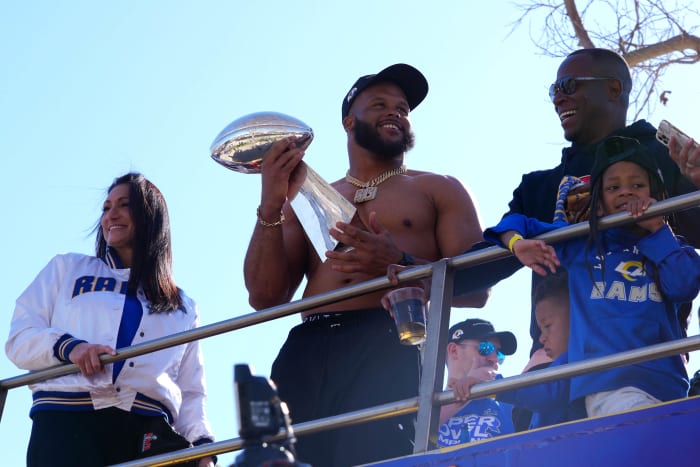 February 16, 2022; Los Angeles, CA, USA; Los Angeles Rams defensive end Aaron Donald holds the Vince Lombardi Trophy during the Super Bowl LVI Championship Parade. Mandatory Credit: Kirby Lee - USA TODAY Sports