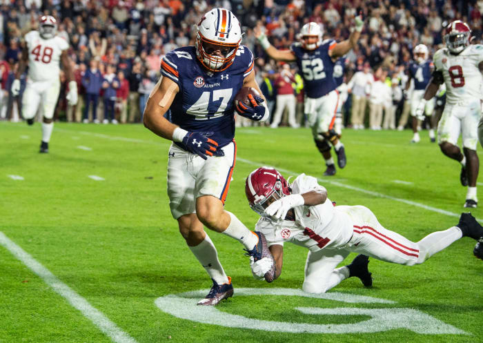 Auburn Tigers tight end John Samuel Shenker (47) breaks free for a touchdown after a catch during overtime during the Iron Bowl at Jordan-Hare Stadium in Auburn, Ala., on Saturday, Nov.  27, 2021. Alabama Crimson Tide defeated Auburn Tigers 24-22 in 4OT.
