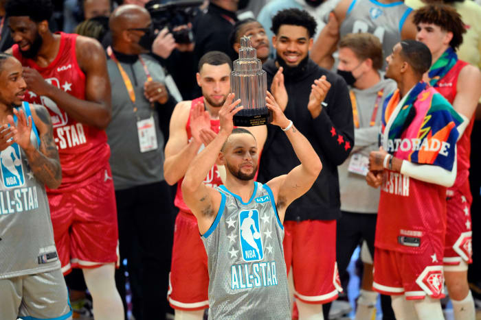 Feb 20, 2022; Cleveland, Ohio, USA; Team LeBron guard Stephen Curry (30) celebrates with a trophy for most valuable player after Team LeBron defeated Team Durant in the 2022 NBA All-Star Game at Rocket Mortgage FieldHouse. Mandatory Credit: David Richard-USA TODAY Sports