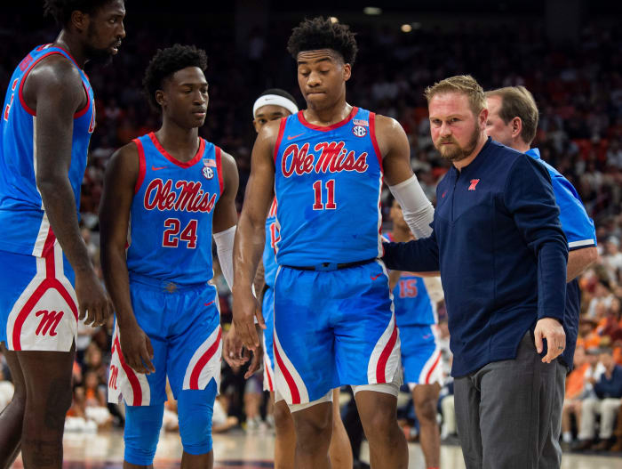 Mississippi Rebels guard Matthew Murrell (11) is helped off the court after suffering an injury as Auburn Tigers take on Mississippi Rebels at Auburn Arena in Auburn, Ala., on Wednesday, Feb. 23, 2022.