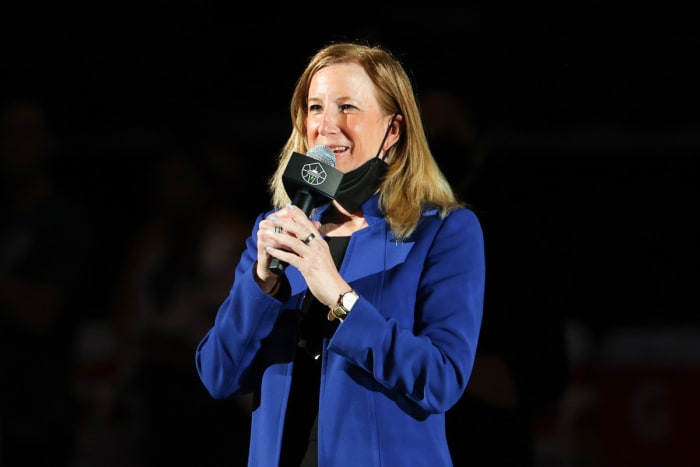 WNBA commissioner Cathy Engelbert holding a microphone