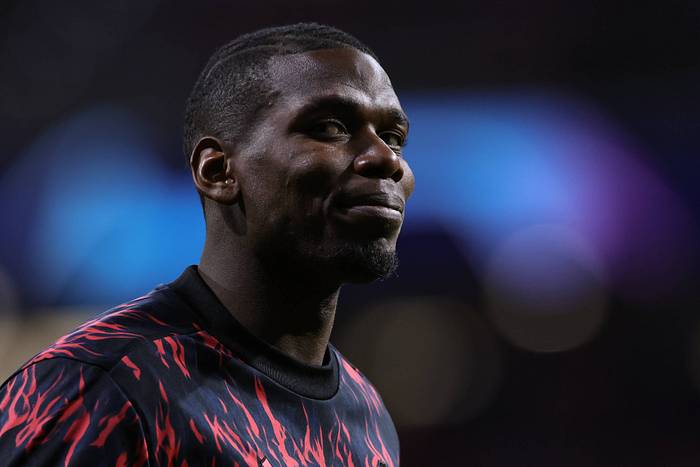 Paul Pogba pictured smiling ahead of Manchester United's game at Atletico Madrid in February 2022