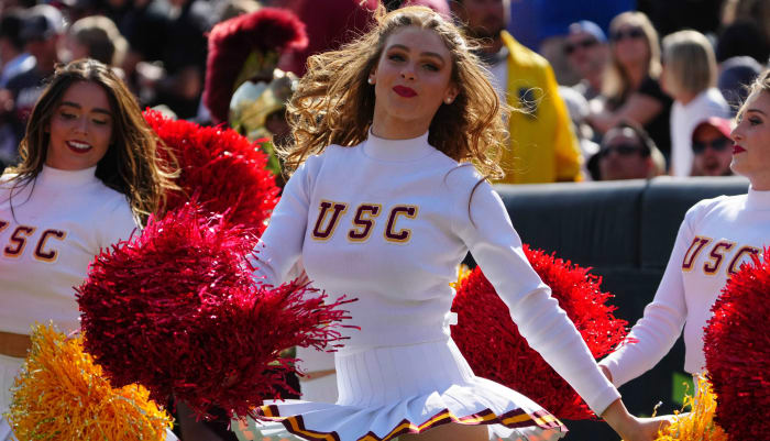 USC Trojans cheerleaders at a college football game.