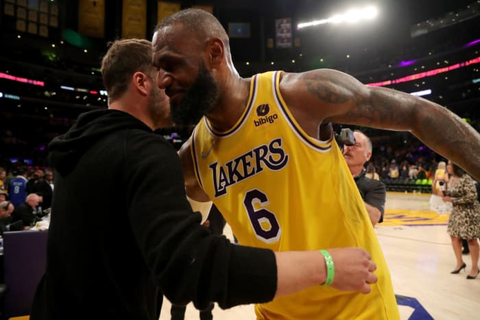 Mar 5, 2022;  Los Angeles, California, USA;  Los Angeles Lakers forward LeBron James (6) hugs Matthew Stafford of the Los Angeles Rams after defeating the Golden State Warriors at Crypto.com Arena.  The Lakers won 124-116.