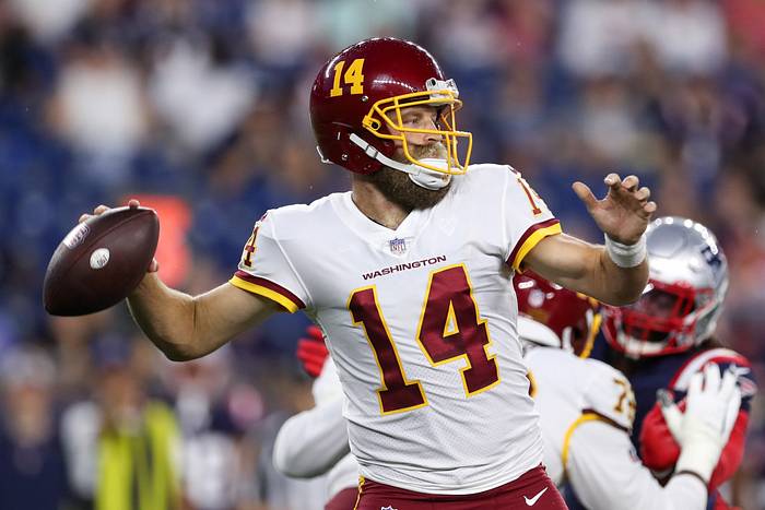 Aug 12, 2021; Foxborough, Massachusetts, USA; Washington Football Team quarterback Ryan Fitzpatrick (14) passes the ball against the New England Patriots during the first half at Gillette Stadium. Mandatory Credit: Paul Rutherford-USA TODAY Sports