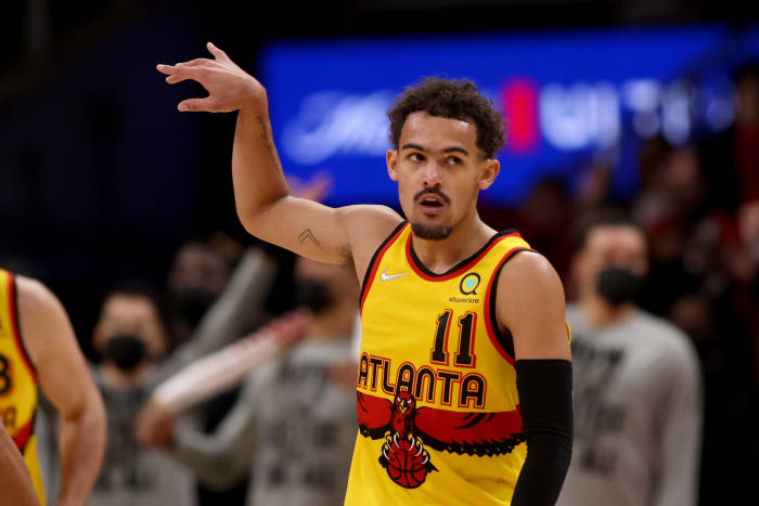 Atlanta Hawks guard Trae Young holds his follow-through after making a shot.