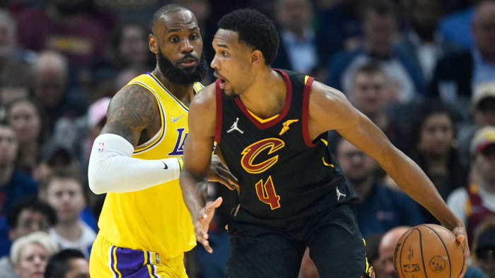 Los Angeles Lakers forward LeBron James defends Cleveland Cavaliers center Evan Mobley