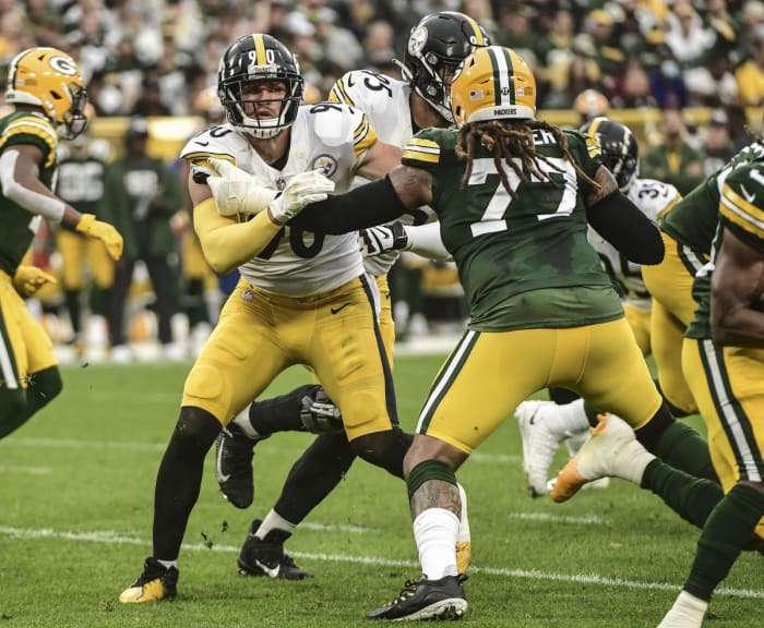 Steelers linebacker TJ Watt (90) tries to get around a block by Green Bay Packers guard Billy Turner (77).  Mandatory Credit: Benny Sieu-USA TODAY