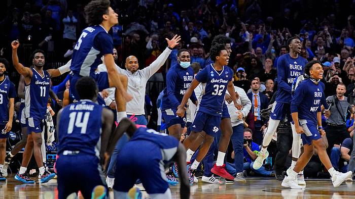 Saint Peter’s celebrates its win over Purdue