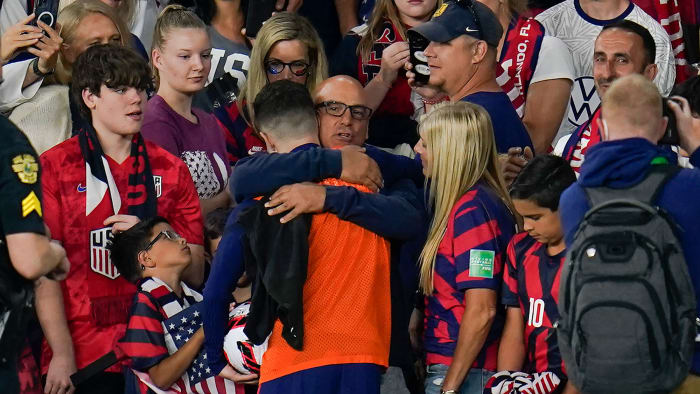 Christian Pulisic hugs his parents after the USMNT's win over Panama