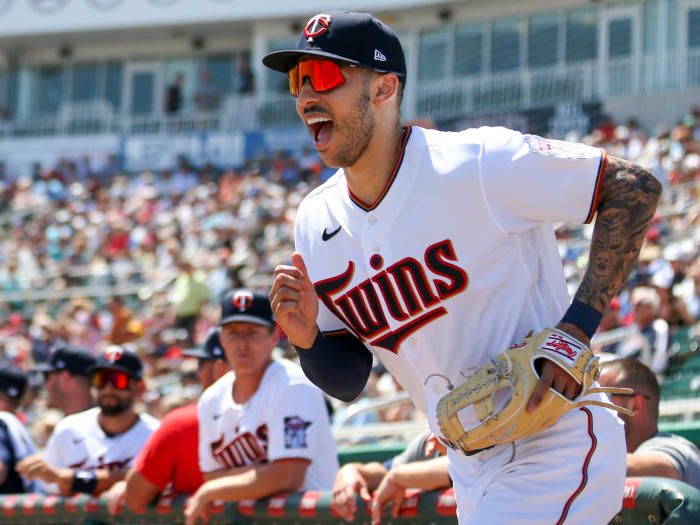 March 27, 2022;  Fort Myers, Florida, USA;  Minnesota Twins shortstop Carlos Correa (4) takes the field before the first inning of the game against the Boston Red Sox during spring training at the CenturyLink Sports Complex.