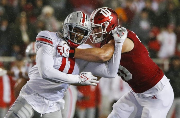 Ohio State defensive end Tyreke Smith (11) moves past Indiana offensive lineman Luke Haggard (70). Joshua A. Bickel/Columbus Dispatch / USA TODAY NETWORK