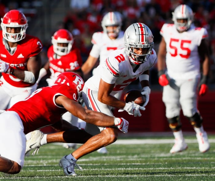 Ohio State Buckeyes receiver Chris Olave (2) fights for yards after a reception against Rutgers. Joshua A. Bickel/Columbus Dispatch / USA TODAY NETWORK