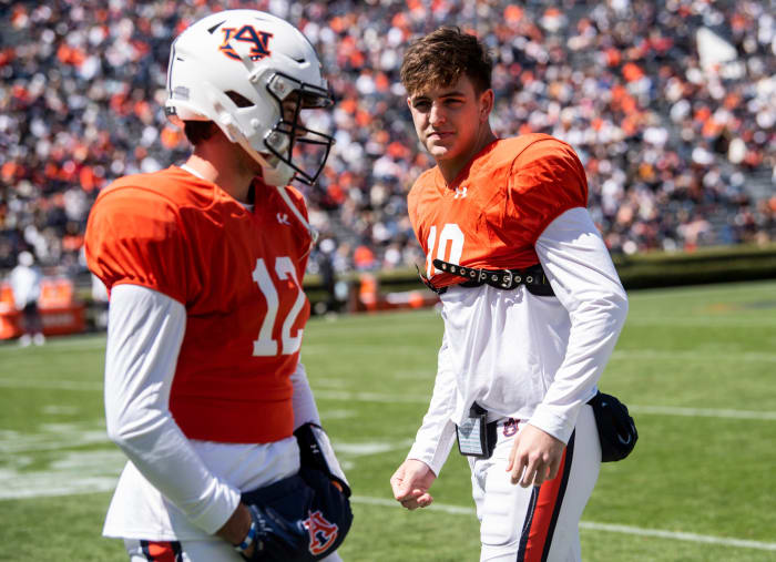 Auburn Tigers quarterback Holden Geriner (12) and Auburn Tigers quarterback Zach Calzada (10) talk on the sideline during the A-Day spring practice at Jordan-Hare Stadium in Auburn, Ala., on Saturday, April 9, 2022.