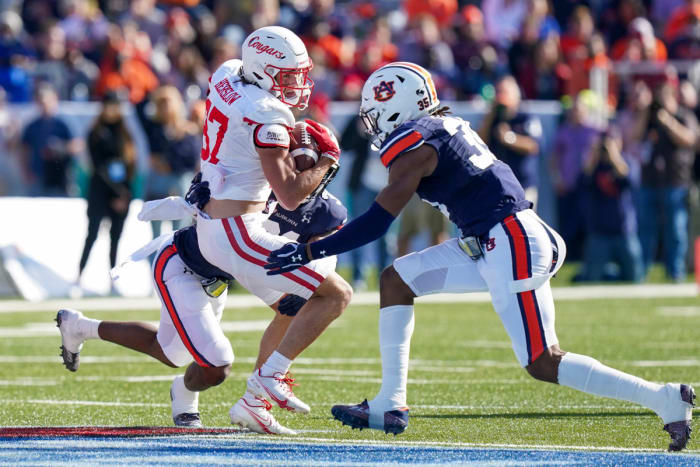Dec 28, 2021;  Birmingham, Alabama, USA;  Houston Cougars wide receiver Jake Herslow (87) is tackled by Auburn Tigers linebacker Chandler Wooten (31) and Auburn Tigers linebacker Cam Riley (35) during the first half of the 2021 Birmingham Bowl at Protective Stadium.  Mandatory Credit: Marvin Gentry-USA TODAY Sports