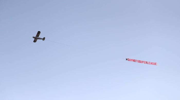 A plane flying over Old Trafford in protest against the Super League.