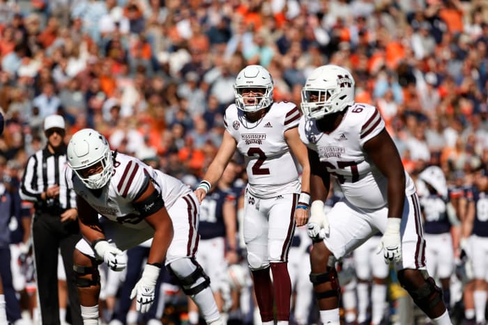 11/13/2021;  Auburn, Alabama, USA;  Mississippi State Bulldogs quarterback Will Rogers (2) changes the game during the first quarter against the Auburn Tigers at Jordan-Hare Stadium.  Mississippi State offensive lineman Charles Cross (67) listens at right.  Mandatory Credit: John Reed-USA TODAY Sports