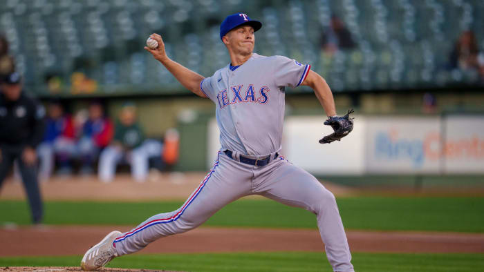 22 April 2022;  Oakland, California, USA;  Texas Rangers starting pitcher Glenn Otto (49) hits the ball in the first inning against Oakland Athletics at the RingCentral Coliseum.  Mandatory Credit: Neville E. Guard-USA TODAY Sports