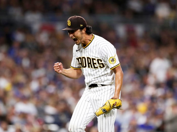 San Diego Padres starting pitcher Yu Darvish celebrates after the last out of the sixth inning of a baseball game against the Los Angeles Dodgers, Saturday, April 23, 2022, in San Diego.