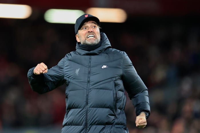 Jurgen Klopp punches the air as he celebrates with Liverpool supporters after his side's 6-0 win over Leeds in February 2022