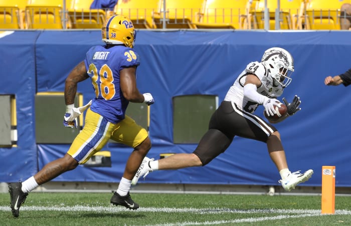 Sep 18, 2021; Pittsburgh, Pennsylvania, USA; Western Michigan Broncos wide receiver Skyy Moore (24) steps out of bounds just short of the end zone past Pittsburgh Panthers linebacker Cam Bright (38) during the fourth quarter at Heinz Field. The Broncos won 44-41. Mandatory Credit: Charles LeClaire-USA TODAY Sports