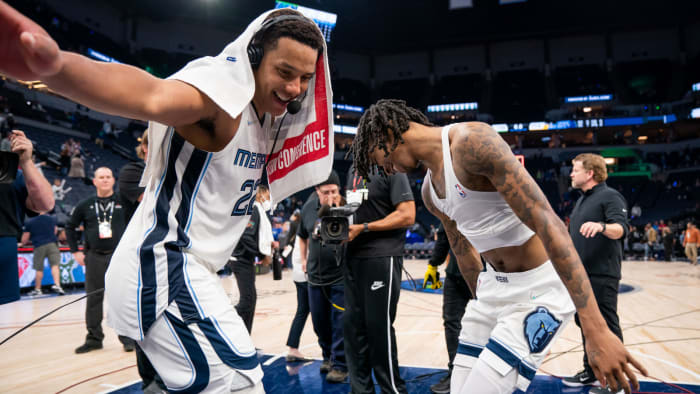 Apr 29, 2022; Minneapolis, Minnesota, USA; Memphis Grizzlies guard Ja Morant (12) and guard Desmond Bane (22) celebrate after the game against the Minnesota Timberwolves after game six of the first round for the 2022 NBA playoffs at Target Center.
