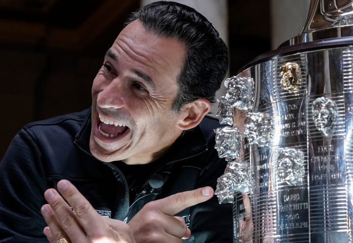 Helio Castroneves admires his face at the Borg-Warner Trophy for winning the Indianapolis 500, a record tied four times.  Photo: Grace Hollars/IndyStar-USA TODAY Network