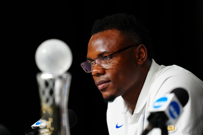 Oscar Tshiebwe decided to stay on at Kentucky rather than jump to the NBA because of the opportunity to earn NIL dollars.