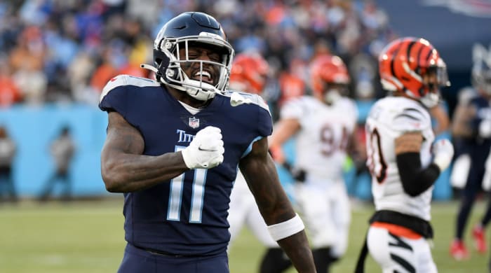 Tennessee Titans wide receiver A.J. Brown (11) celebrates after a catch during the first half of an AFC Divisional playoff football game against the Cincinnati Bengals at Nissan Stadium