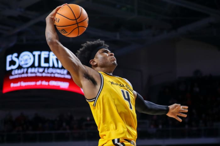 Wichita State Shockers guard Ricky Council IV (4) dunks over the Cincinnati Bearcats in the second half at Fifth Third Arena.