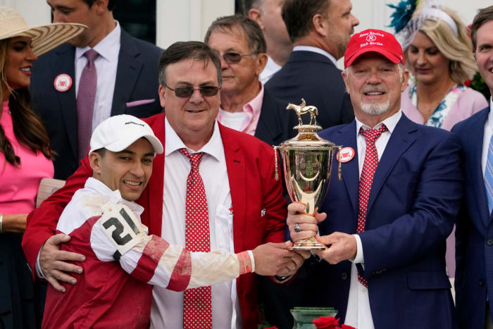 Jockey Sonny Leon, trainer Eric Reed and owner Rick Dawson celebrate their first Derby win in their first Derby appearance with Rich Strike.