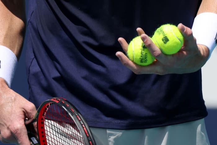 March 28, 2021; Miami, Florida, USA. Canada's Felix Auger has his four balls in hand before he faces Ariassime (not pictured) in the third round of the Miami Open at Hard Rock Stadium. Mandatory credit: Geoff Burke-USA TODAY Sports
