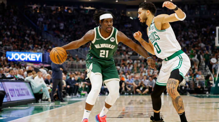 Milwaukee Bucks guard Jrue Holiday (21) drives for the basket as Boston Celtics forward Jayson Tatum (0) defends during the second quarter during game six of the second round for the 2022 NBA playoffs at Fiserv Forum.