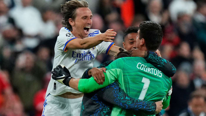 Luka Modric and Thibaut Courtois celebrate the Champions League title