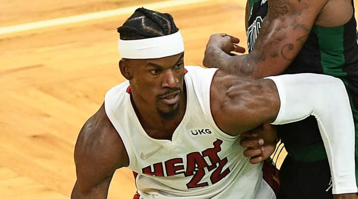 Miami Heat forward Jimmy Butler (22) moves the ball against Boston Celtics guard Marcus Smart (36) in the second half of game six of the 2022 Eastern Conference Finals at TD Garden.