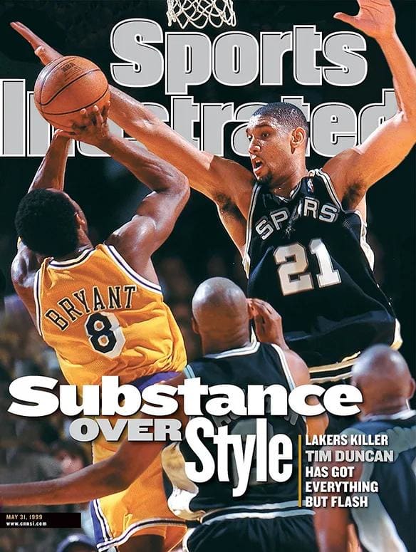 Tim Duncan plays defense on the cover of Sports Illustrated in 1999