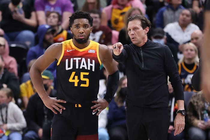 Utah Jazz guard Donovan Mitchell (45) and head coach Quin Snyder speak during a break in action in the fourth quarter at Vivint Arena.